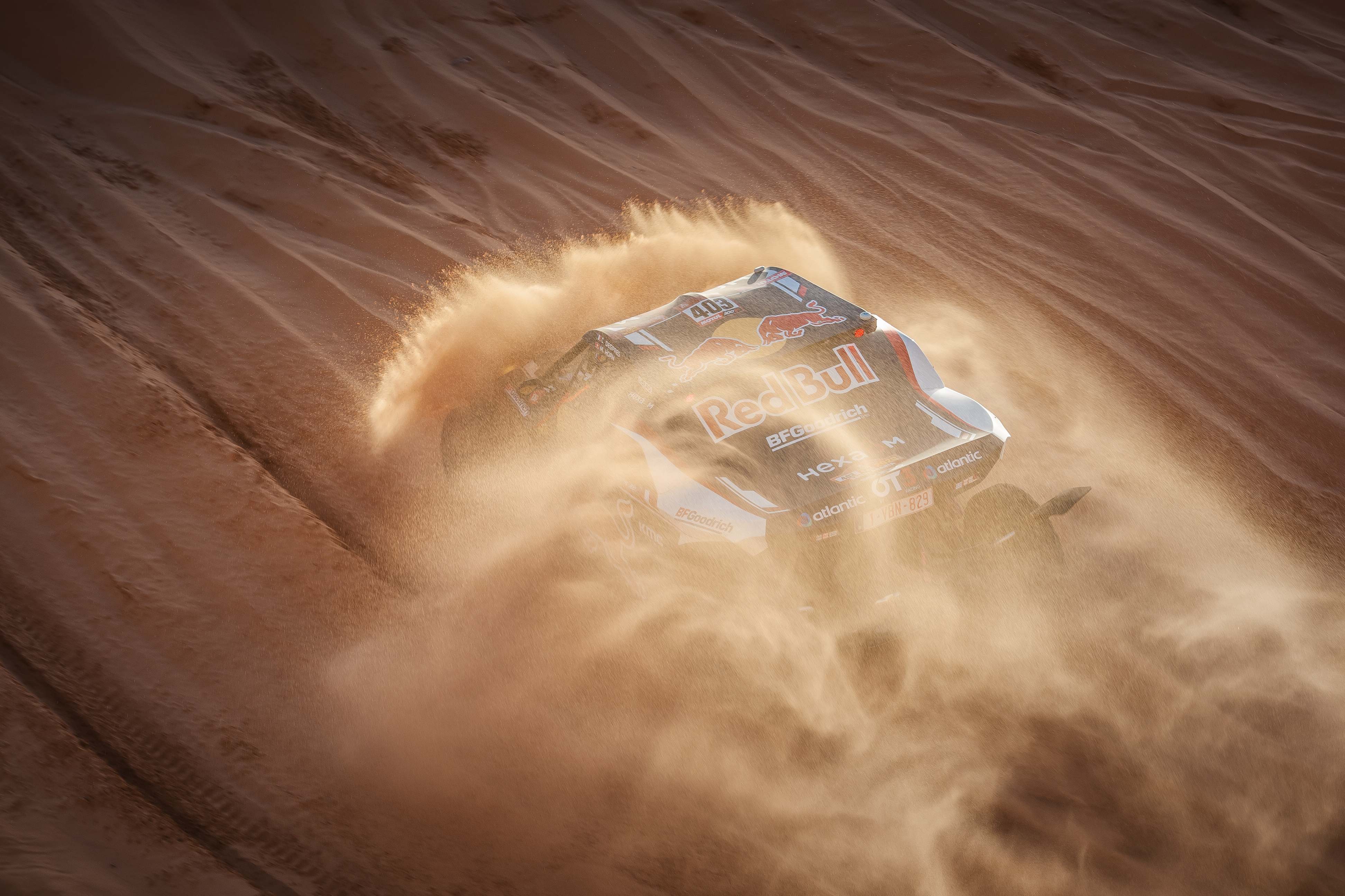 Rally car in the Empty Quarter during the Dakar Rally