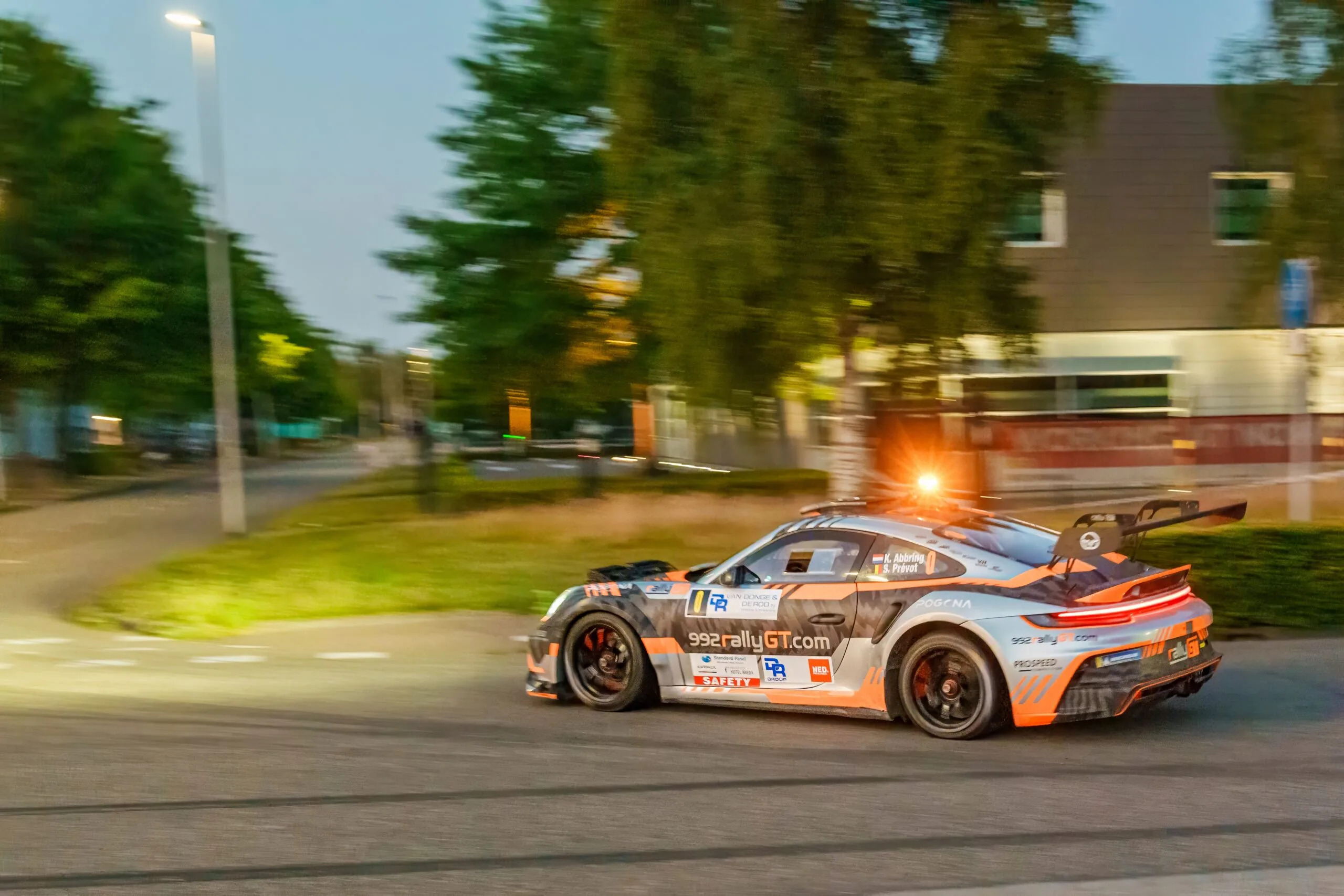 Race car at dusk during a street race