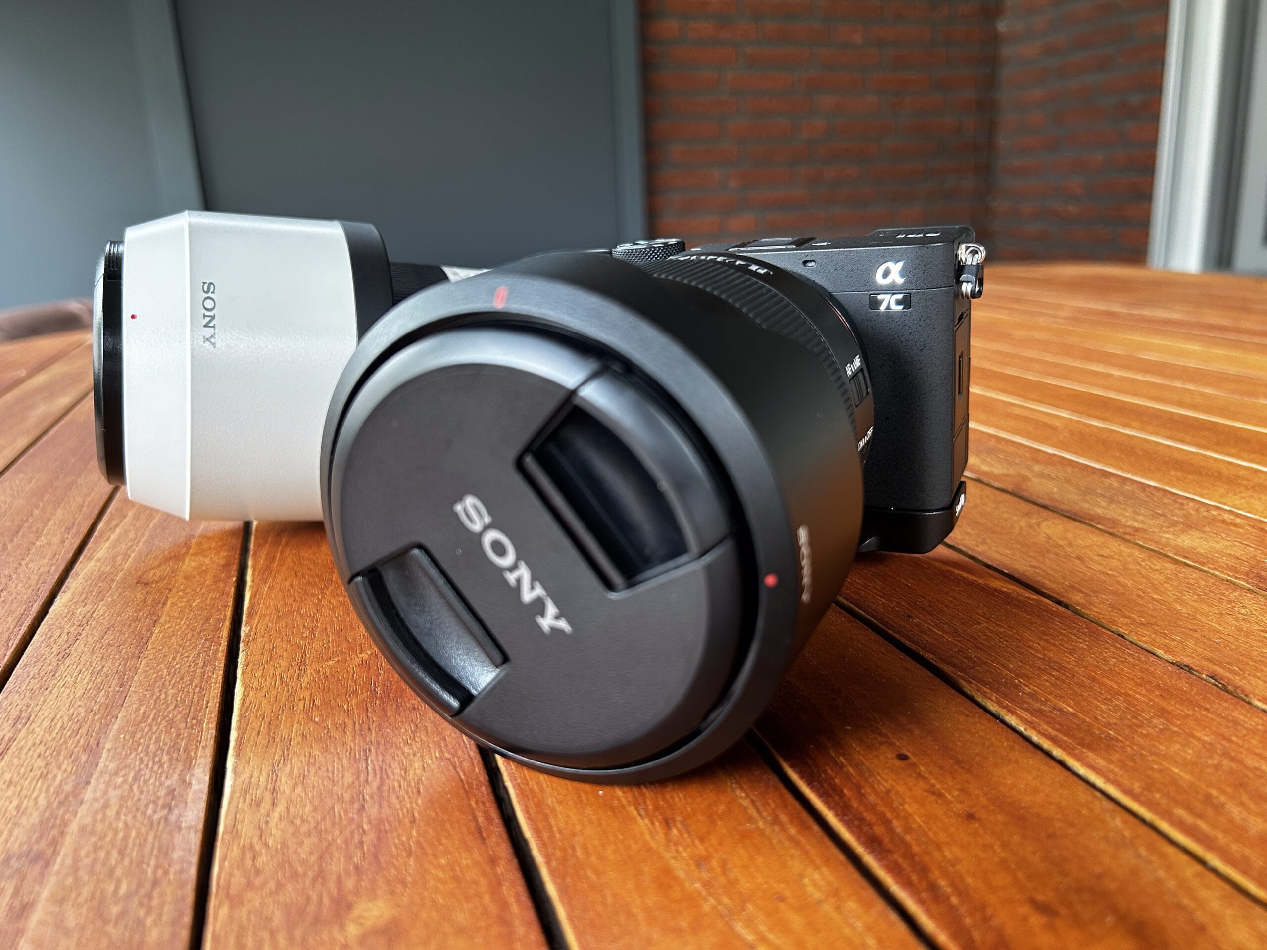 Sony Alpha 7C II with lens on a wooden table